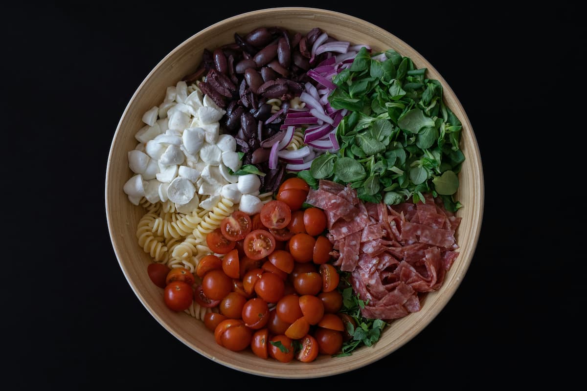 bowl of healthy veggies meats and cheeses